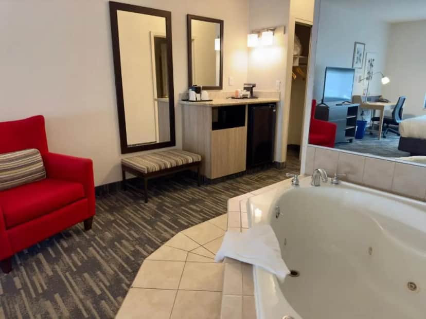 Private in-room jacuzzi tub in the King Suite with Whirlpool - Non-Smoking at Country Inn & Suites by Radisson, Lake George Queensbury, NY