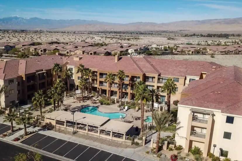 an aerial view of a resort with a swimming pool at Courtyard Palm Desert in Palm Desert