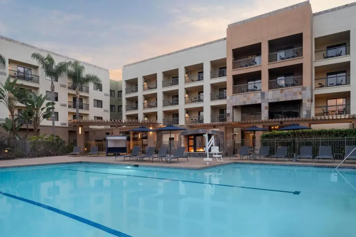 a large swimming pool in front of a hotel at Courtyard by Marriott San Diego Central in San Diego