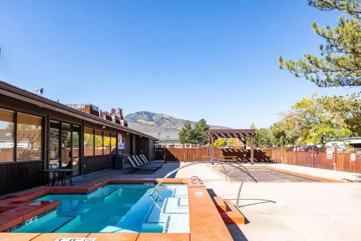 Shared outdoor hot tub at Cozy stay for 4, 5 Min Drive to Base, Full Kitchen, Shared Hot Tub & Pool, Restaurants Nearby!
