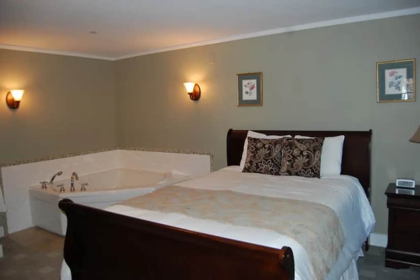 Private in-room jacuzzi tub in the Suite, 1 King Bed with Sofa bed, Fireplace at Cranmore Inn and Suites, a North Conway boutique hotel