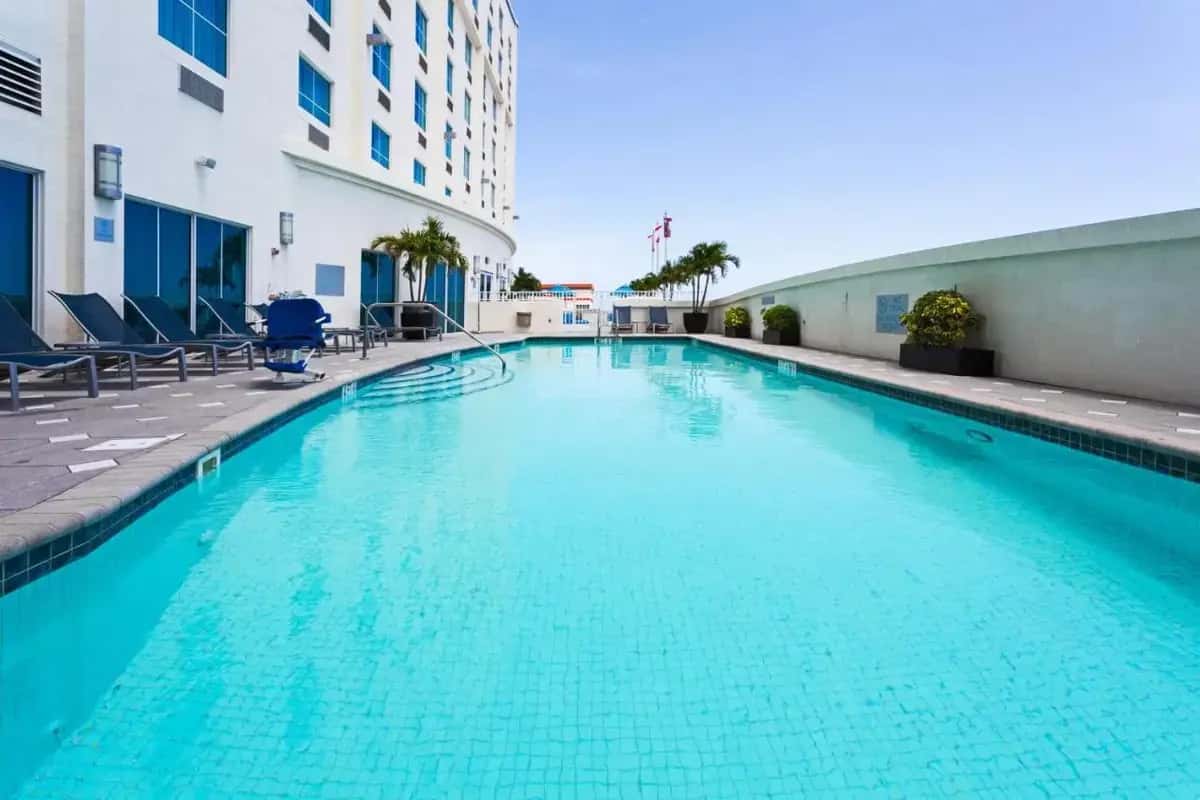 a swimming pool in the middle of a building at Crowne Plaza Hotel & Resorts Fort Lauderdale Airport/ Cruise by IHG in Fort Lauderdale