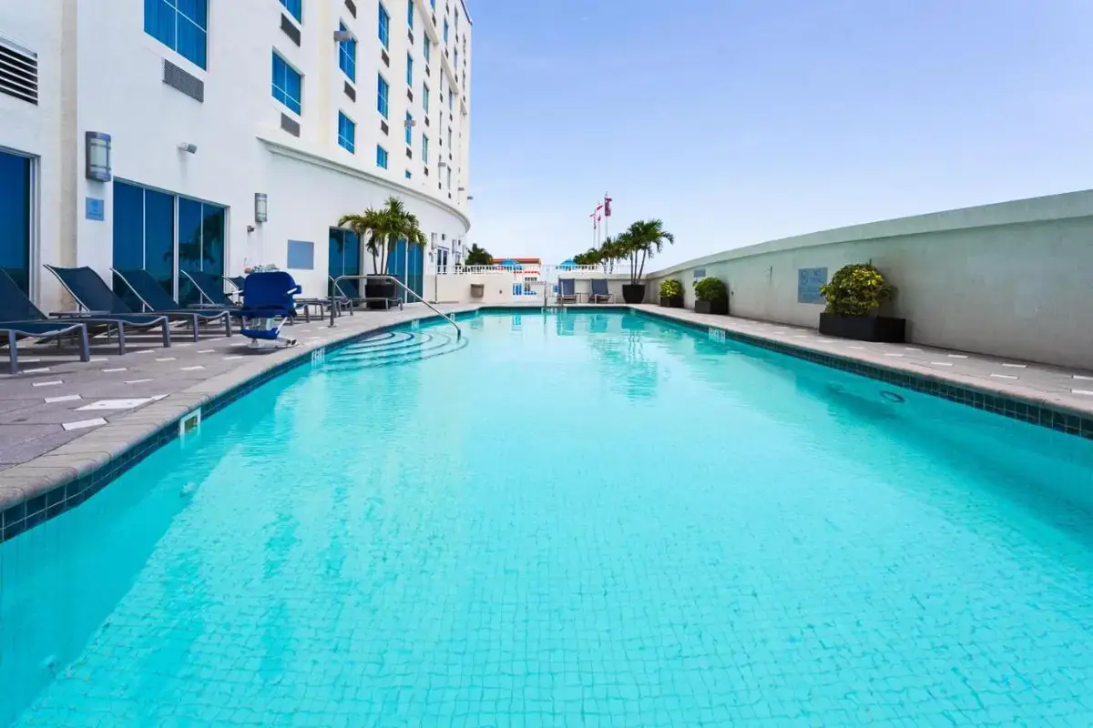 a swimming pool in the middle of a building at Crowne Plaza Hotel & Resorts Fort Lauderdale Airport/ Cruise by IHG in Fort Lauderdale