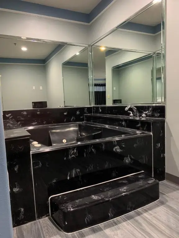 Private in-room jacuzzi tub in the King Room with Spa Bath- Smoking at Crystal Suites