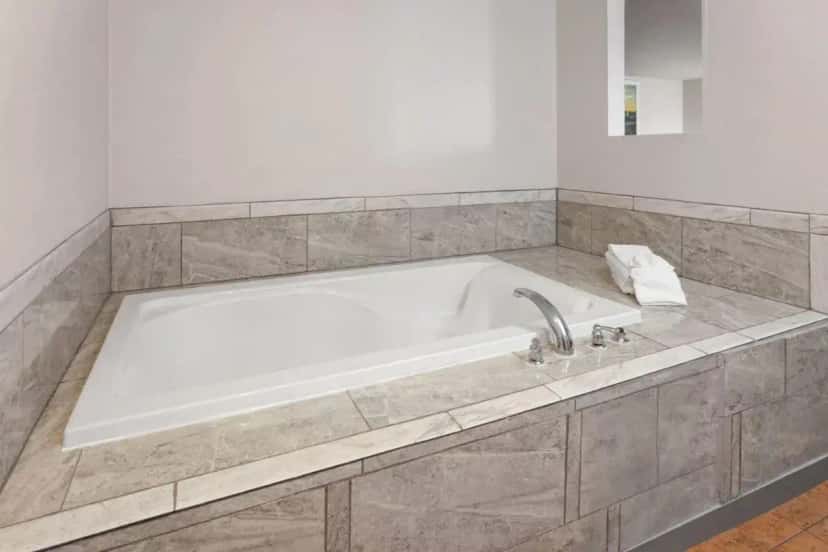 In-room jacuzzi tub at Days Inn & Suites by Wyndham Spokane Airport Airway Heights in Airway Heights, WA