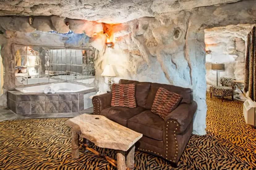 Private in-room jacuzzi tub in the Jurassic Cave One Bedroom King Suite - Non-Smoking at Days Inn & Suites by Wyndham Terre Haute