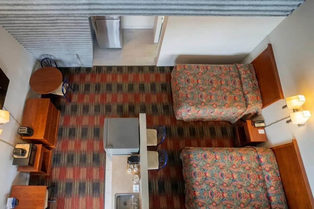 an overhead view of a hotel room with two chairs at Carolina Inn Anderson Clemson Area in Anderson