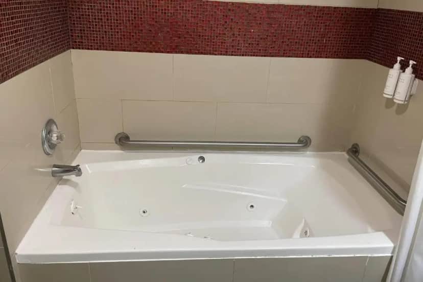Private in-room jacuzzi tub in the King Room - Mobility Access/Smoking at Days Inn by Wyndham Jersey City