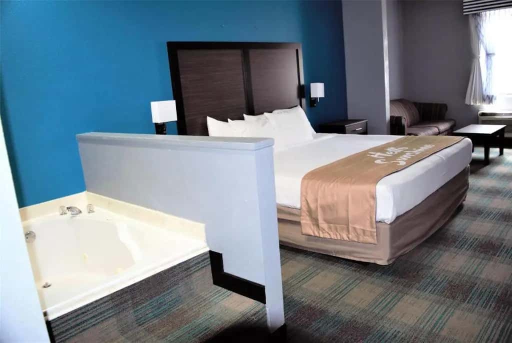 Private in-room jacuzzi tub in the Deluxe King Suite at Days Inn by Wyndham Montgomery