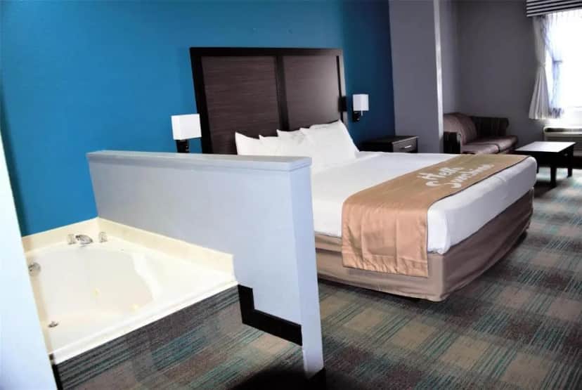 Private in-room jacuzzi tub in the Deluxe King Suite at Days Inn by Wyndham Montgomery