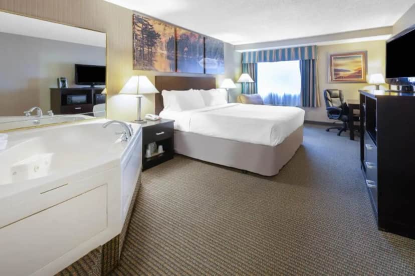 Private in-room jacuzzi tub in the Deluxe King Room - Non-Smoking at Days Inn by Wyndham Plattsburgh