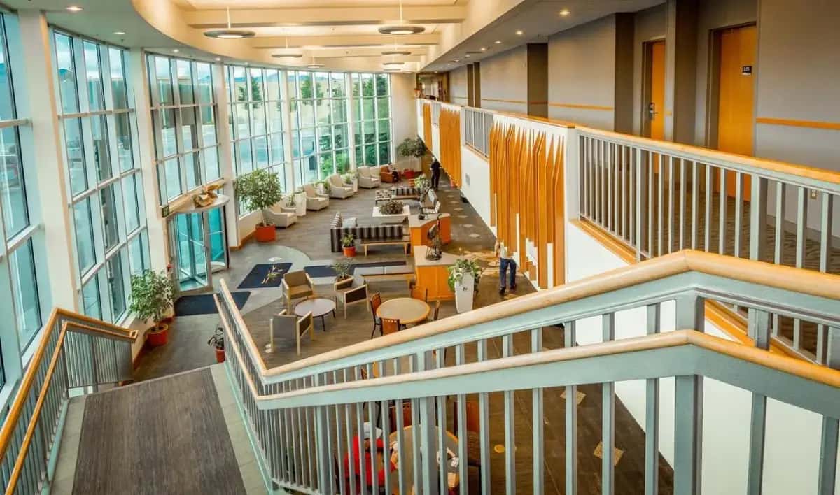 an overhead view of an office lobby with tables and chairs at Dimond Center Hotel in Anchorage