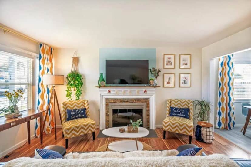 a living room with a fireplace and a tv at Hello Sunshine OC minutes to Disneyland-Family Friendly in Fullerton