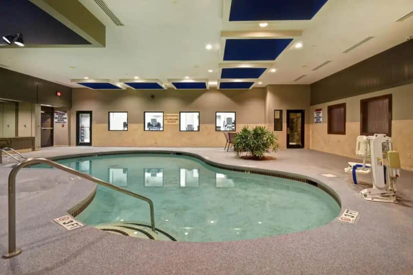 a pool in a hotel lobby with a hot tub at DoubleTree by Hilton Hotel Augusta in Augusta