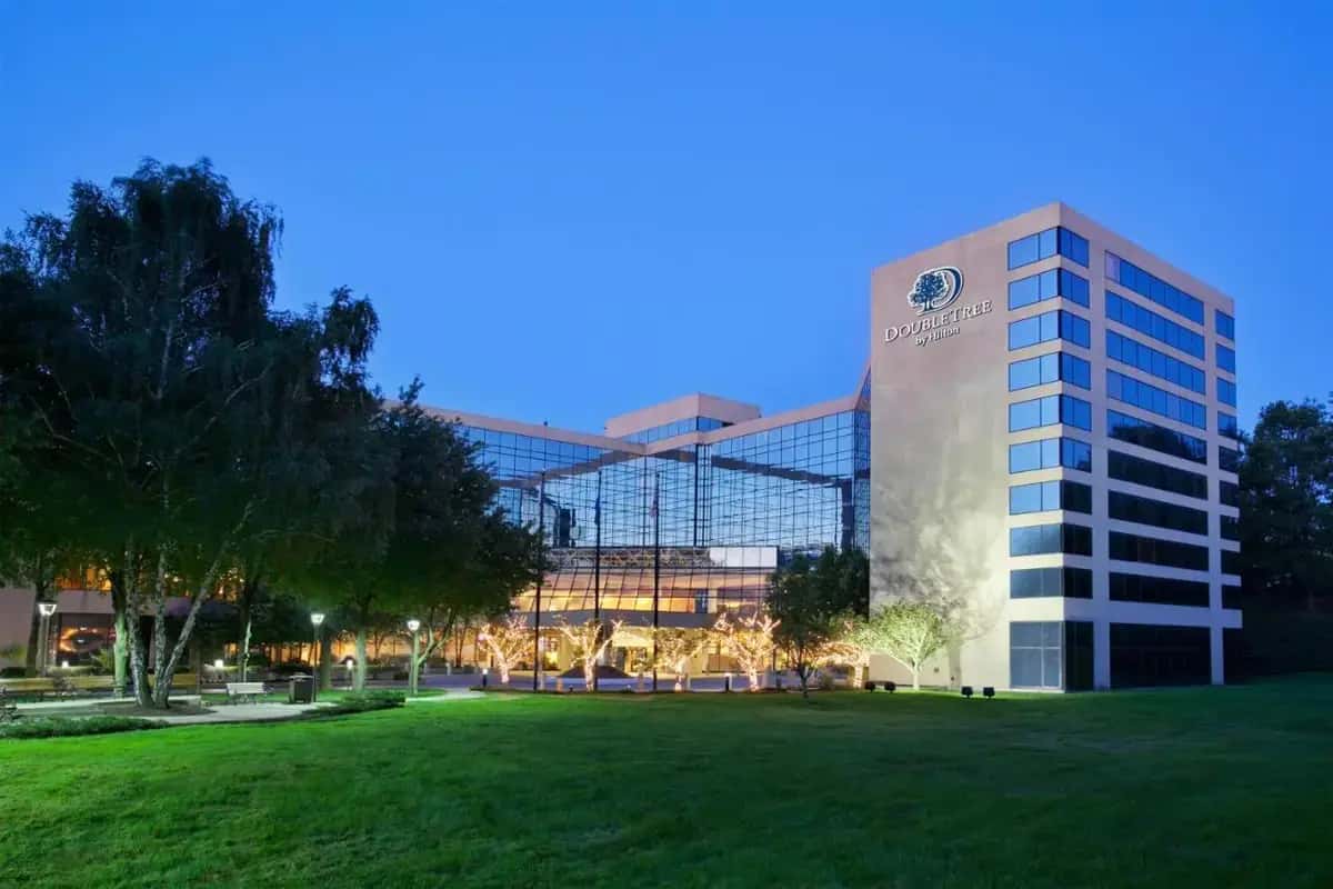 a building with a lawn in front of it at DoubleTree by Hilton Stamford in Stamford