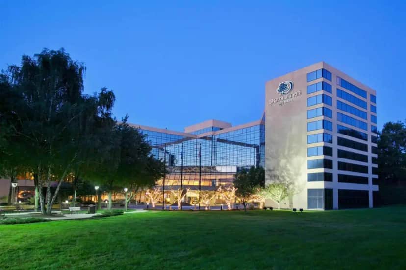 a building with a lawn in front of it at DoubleTree by Hilton Stamford in Stamford