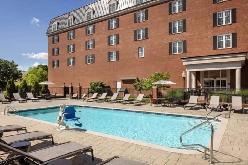 a swimming pool in front of a building at DoubleTree Suites by Hilton Lexington in Lexington