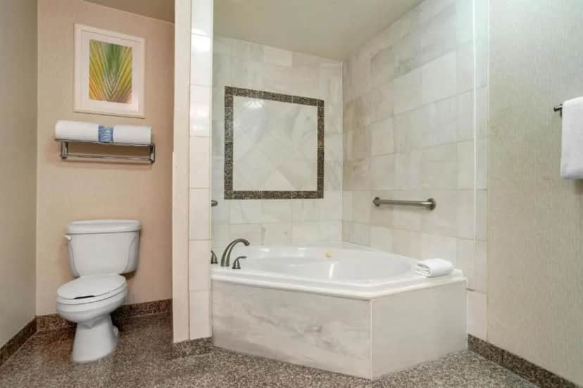 Private in-room jacuzzi tub in the Deluxe King Room with Spa Bath at Drury Inn & Suites Baton Rouge