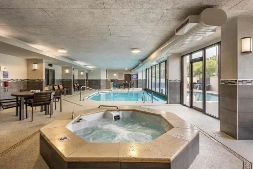 a large pool with a hot tub in a building at Drury Inn & Suites Springfield MO in Springfield