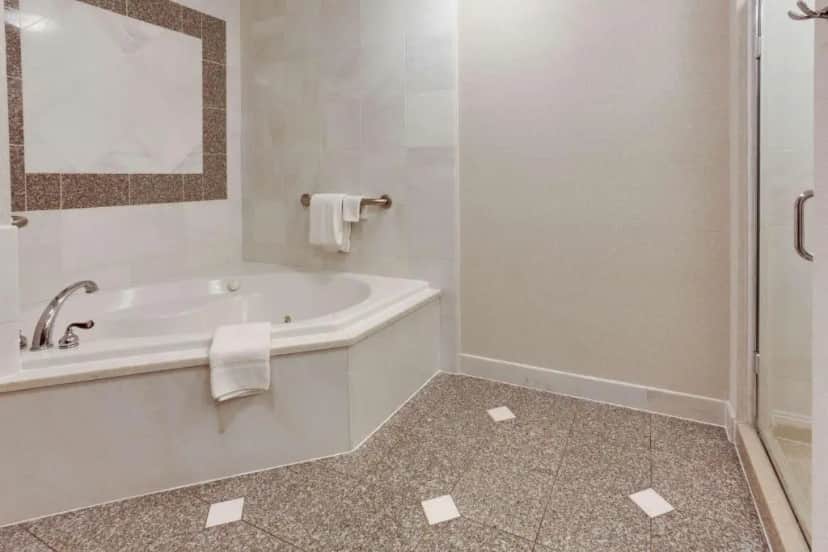 Private in-room jacuzzi tub in the Deluxe King Room with Spa Bath at Drury Inn & Suites West Des Moines