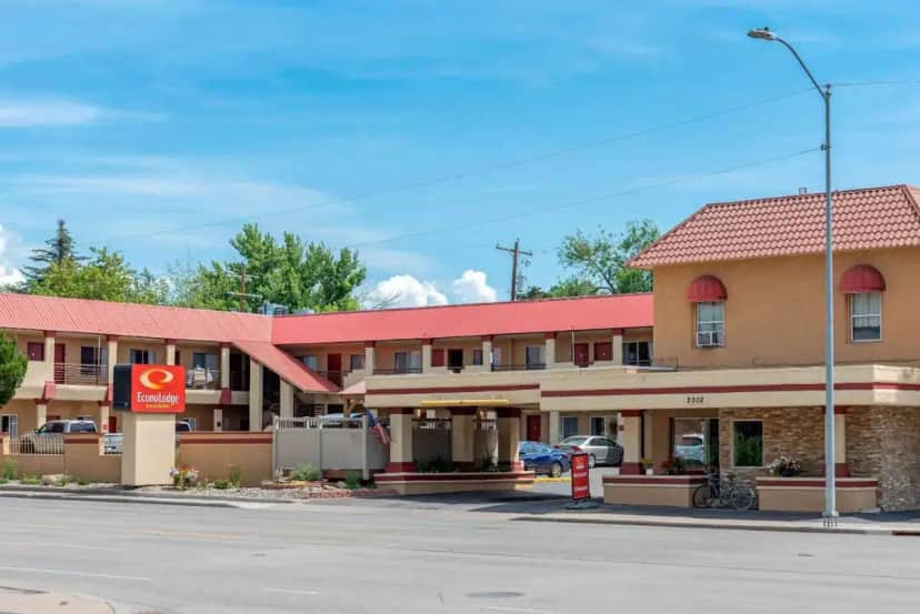 a hotel on the corner of a street with a gas station at Econo Lodge Inn & Suites Durango in Durango