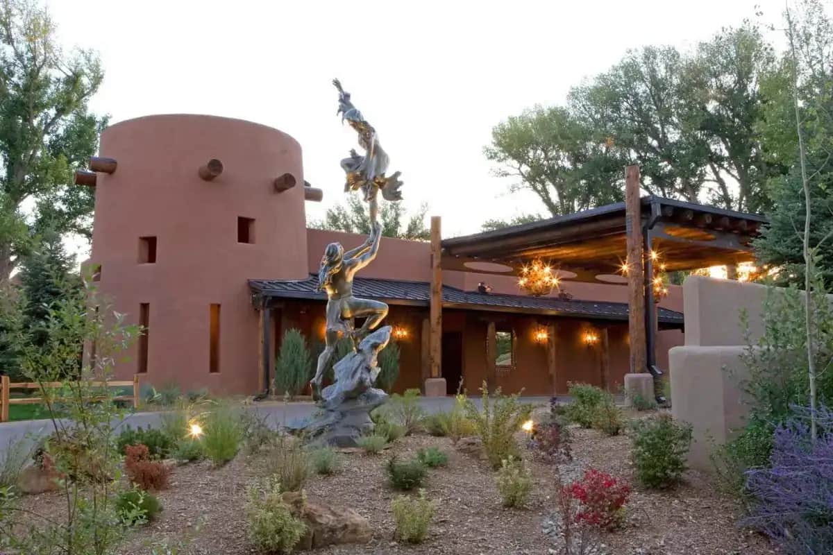 a house with a statue in front of it at El Monte Sagrado Resort & Spa in Taos