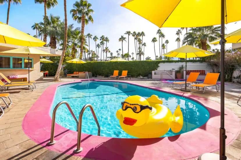 a pool with a rubber duck in the middle at El Noa Noa - 21 and Over in Palm Springs