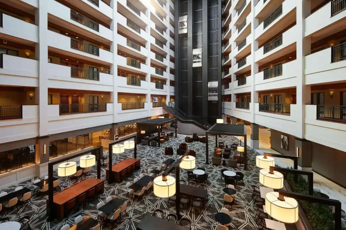 an overhead view of a hotel lobby with tables and chairs at Embassy Suites Huntsville in Huntsville
