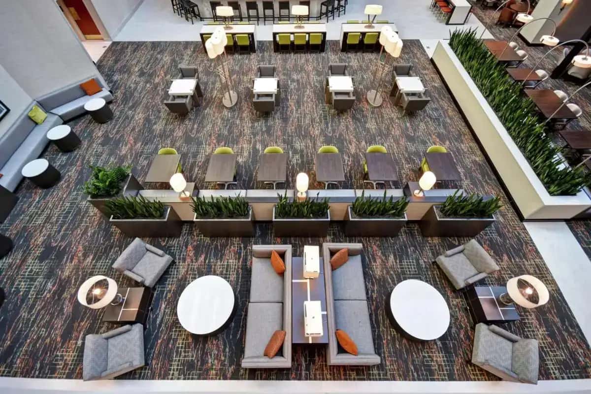 an overhead view of a restaurant with tables and chairs at Embassy Suites Little Rock in Little Rock