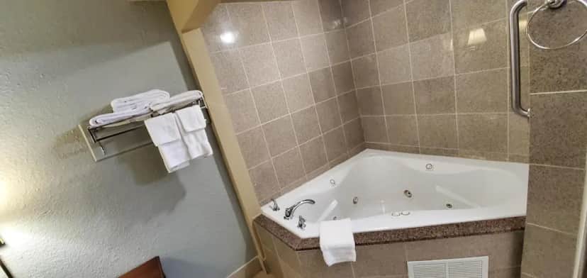 Private in-room jacuzzi tub in the Deluxe Suite, 1 King Bed, Hot Tub at FairBridge Inn & Suites McDonough