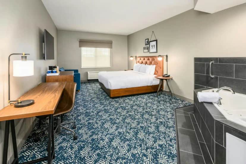 Private in-room jacuzzi tub in the King Studio Suite with Sofa Bed and Spa Bath at Four Points by Sheraton Bedford Manchester Airport