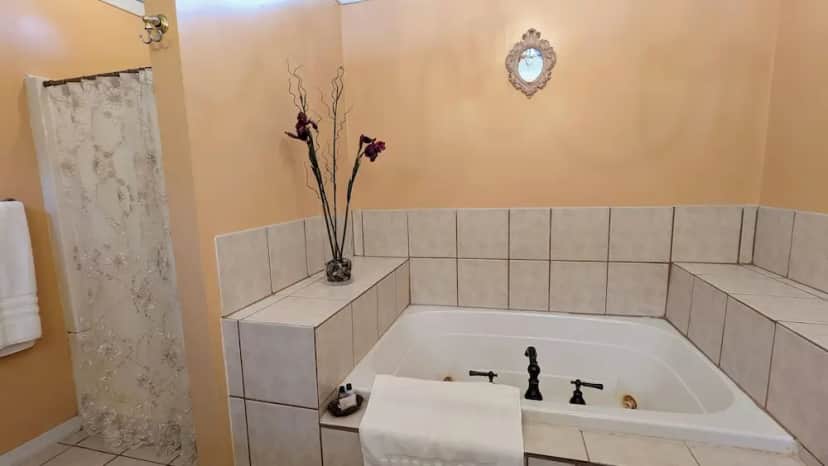 Private in-room jacuzzi tub in the Romantic Suite, 1 King Bed, Jetted Tub at Garden and Sea Inn