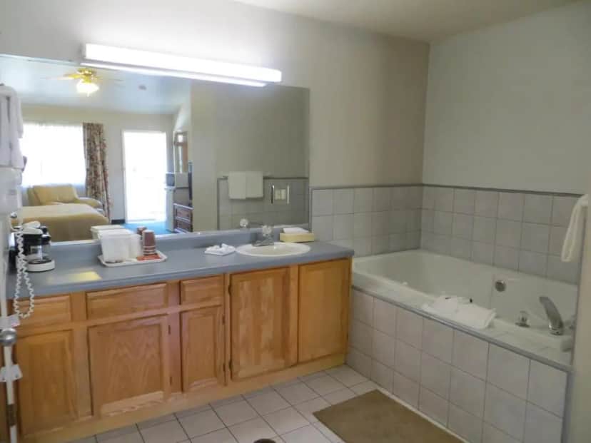 Private in-room jacuzzi tub in the King Room with Spa Bath at Garden Inn and Suites