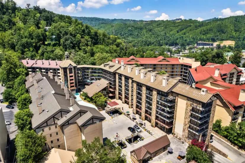 an aerial view of a resort with mountains in the background at Gatlinburg Town Square in Gatlinburg