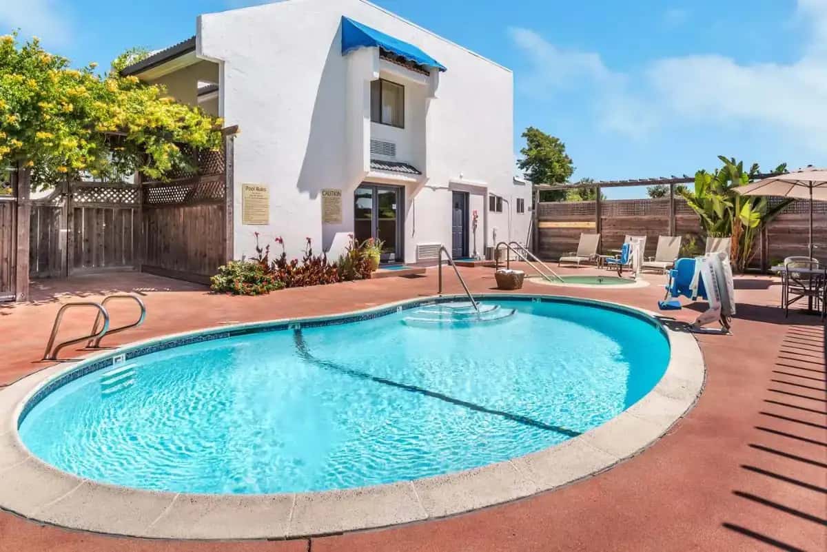 a swimming pool in front of a house at GoodSpring Motel in Napa