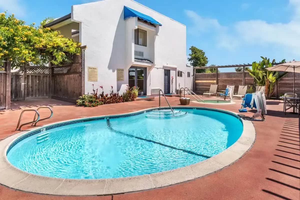 a swimming pool in front of a house at GoodSpring Motel in Napa