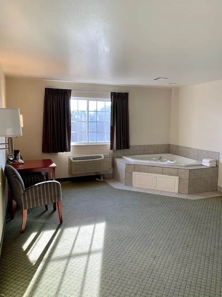 Private in-room jacuzzi tub in the Room, 1 King Bed with Sofa bed, Non Smoking, Jetted Tub at Grandstay Hotel & Suites Becker - Big Lake