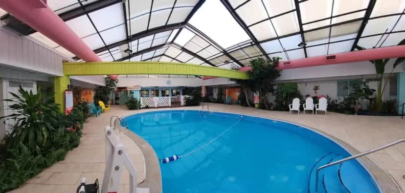 a large swimming pool in a building with a ceiling at Greenfield Inn & Suites Elizabethtown, KY I65 Exit 94 in Elizabethtown