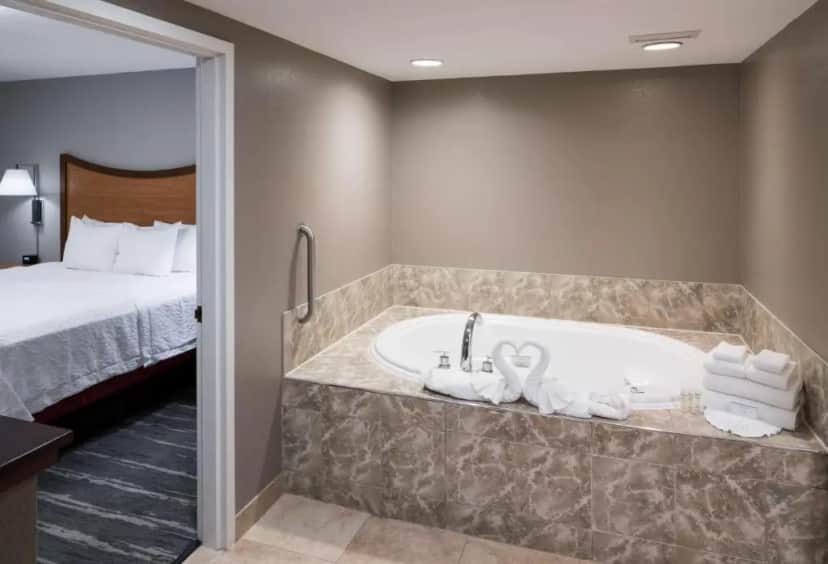 Private in-room jacuzzi tub in the One-Bedroom King Suite with Whirlpool - Non-Smoking at Hampton Inn & Suites Chicago-North Shore/Skokie