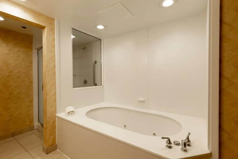 Private in-room jacuzzi tub in the One-Bedroom King Suite with Whirlpool - Non-Smoking at Hampton Inn & Suites Jacksonville Deerwood Park