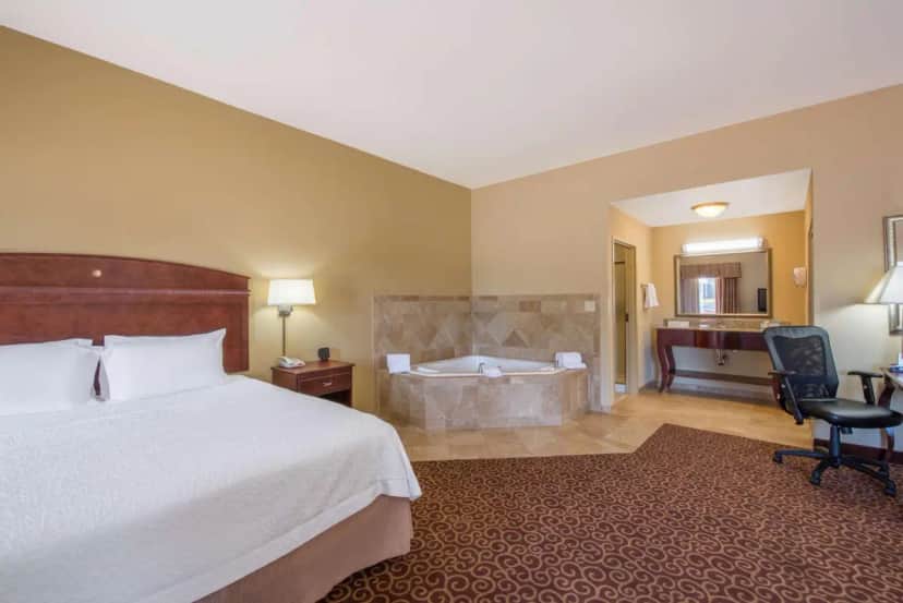 Private in-room jacuzzi tub in the One-Bedroom King Suite with Whirlpool - Non-Smoking at Hampton Inn & Suites Oklahoma City - South