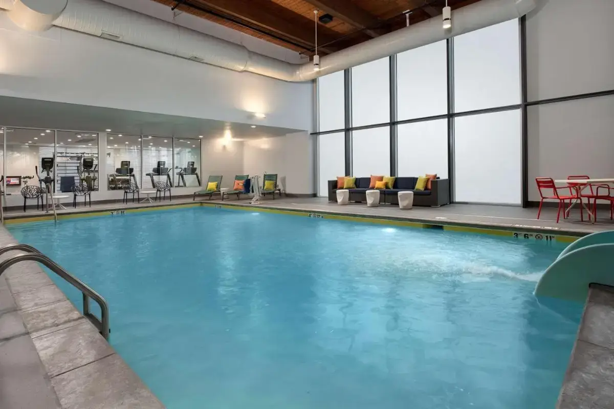 a large pool with blue water in a building at Hampton Inn & Suites Rapid City Rushmore, SD in Rapid City
