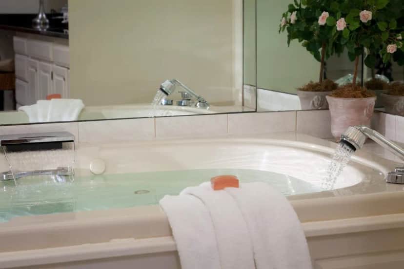 Private in-room jacuzzi tub in the Deluxe Queen Room with Fireplace and Spa Bath at Harbor Light Inn
