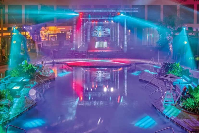 an indoor pool with lights in a building at Harrah's Resort Atlantic City, A Caesars Destination in Atlantic City