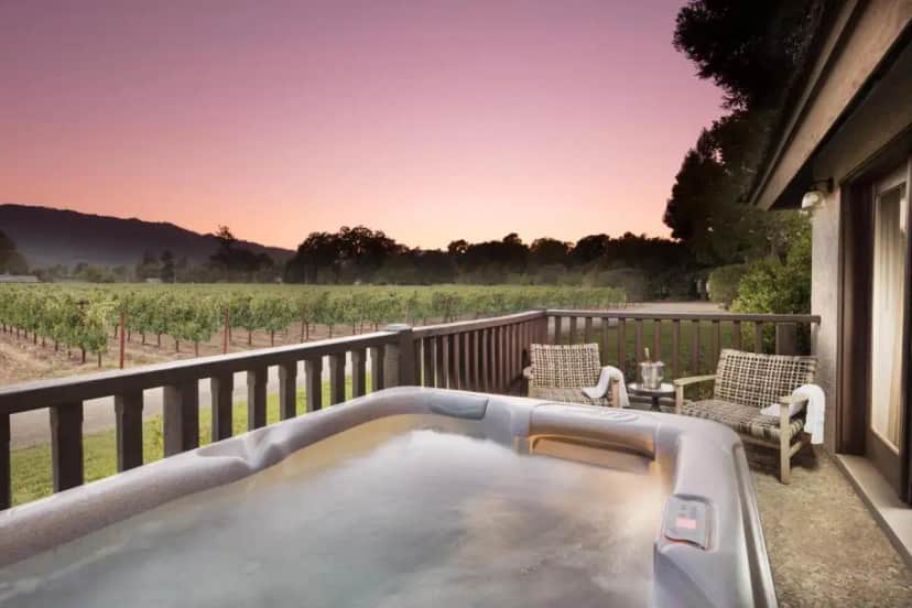 a hot tub on the deck of a house at Harvest Inn in St. Helena