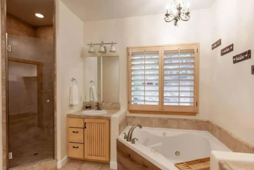 a bathroom with a tub and a shower and a sink at Hillside Hideaway - game rm - master spa - Luxury in Lake Arrowhead