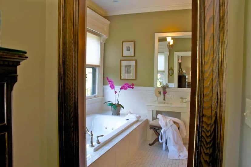 Private in-room jacuzzi tub in the Deluxe Double Room with Balcony - Stewart Room at Hilltop Inn