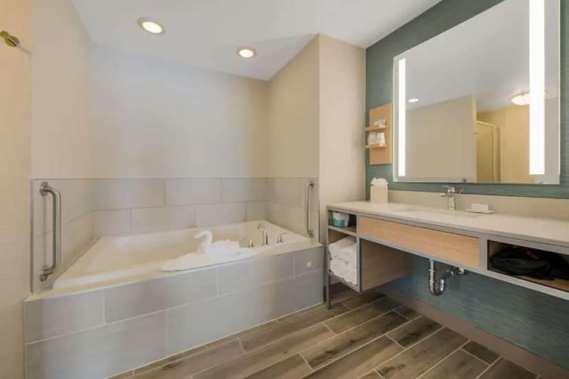 Private in-room jacuzzi tub in the One-Bedroom King Suite with Sofa Bed at Hilton Garden Inn Rockford