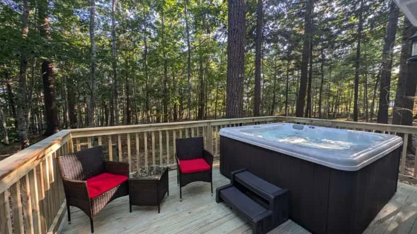 Private outdoor hot tub at Hinckleys Dreamwood Cottages in Bar Harbor, ME