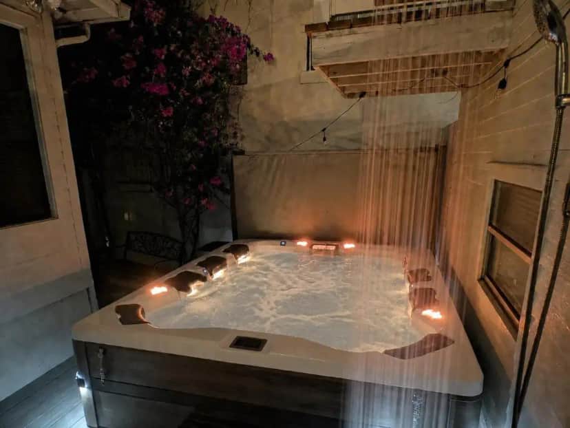 a hot tub with candles in a bath room at Historic Ember Room at The Knickerbocker in Tampa
